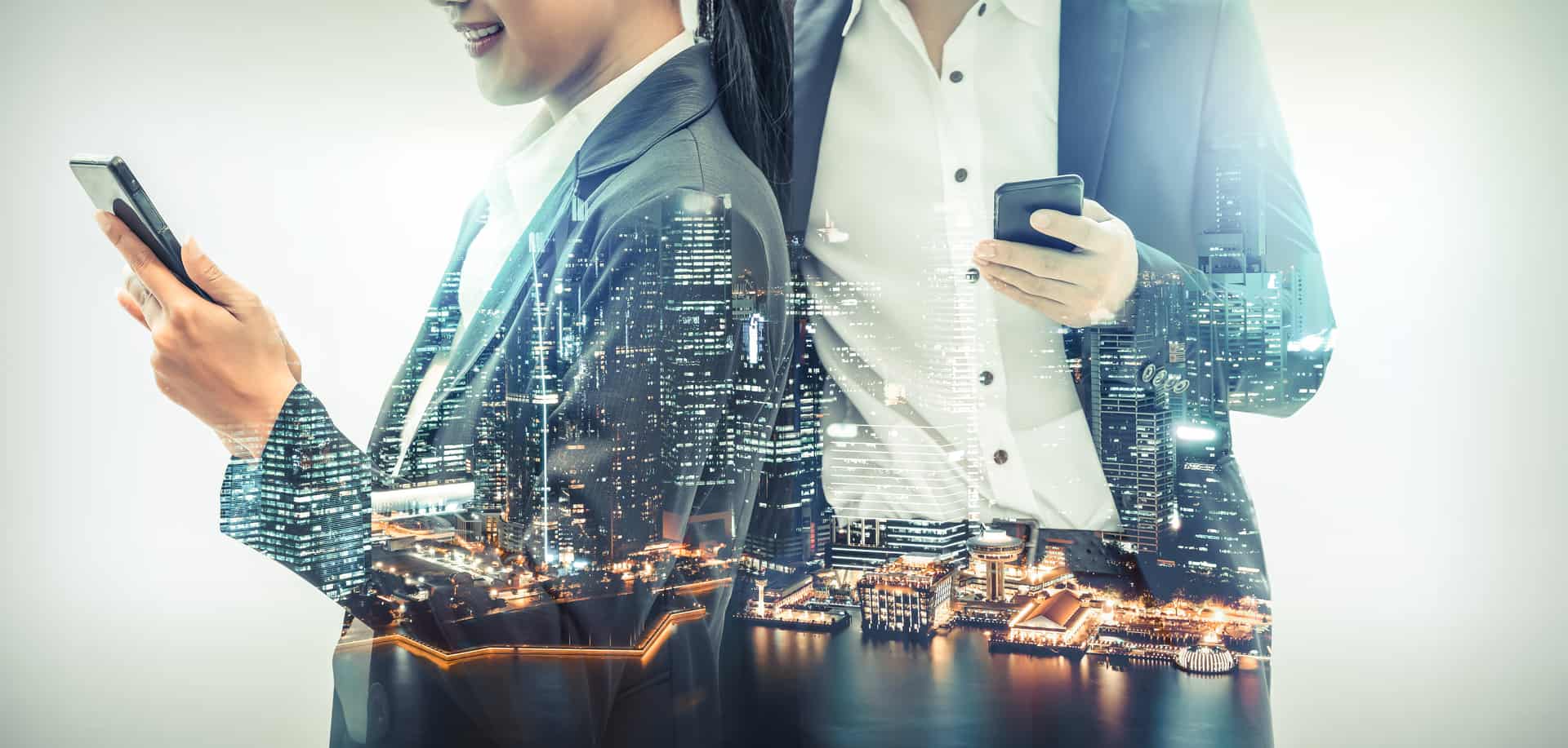 Double exposure of businesspeople using smartphones and a busy city representing white label SMS gateway services. 